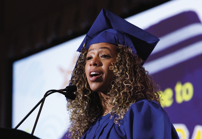 Eczema advocate Ashley Ann Lora speaking at Eczema Expo 2025 graduation ceremony